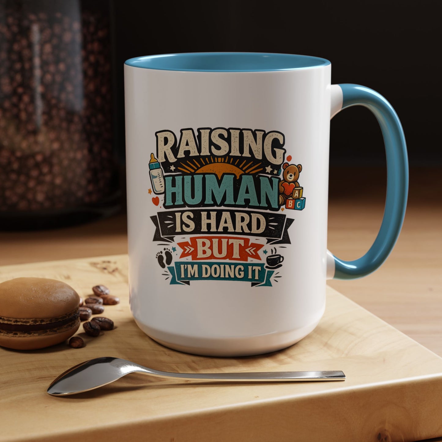 Accent Coffee Mug — "Raising Humans Is Hard But I'm Doing It"