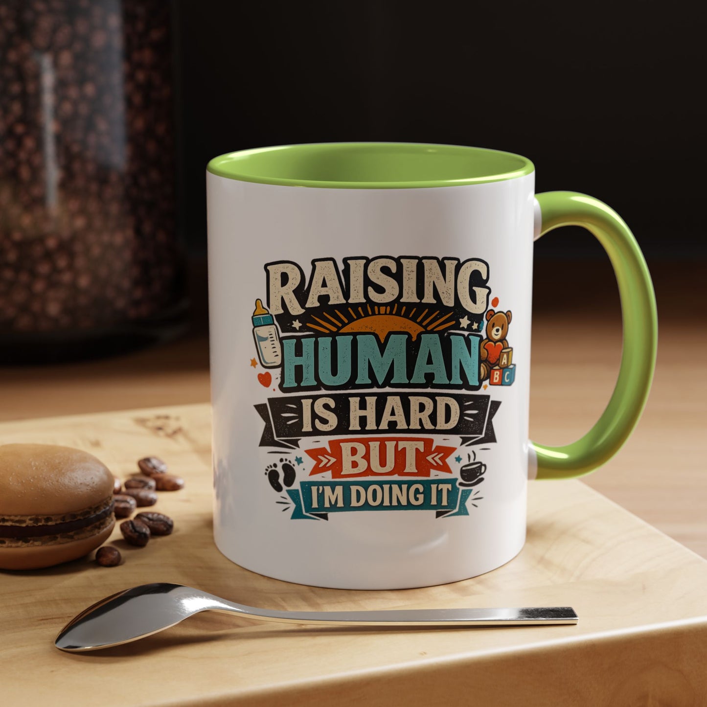Accent Coffee Mug — "Raising Humans Is Hard But I'm Doing It"