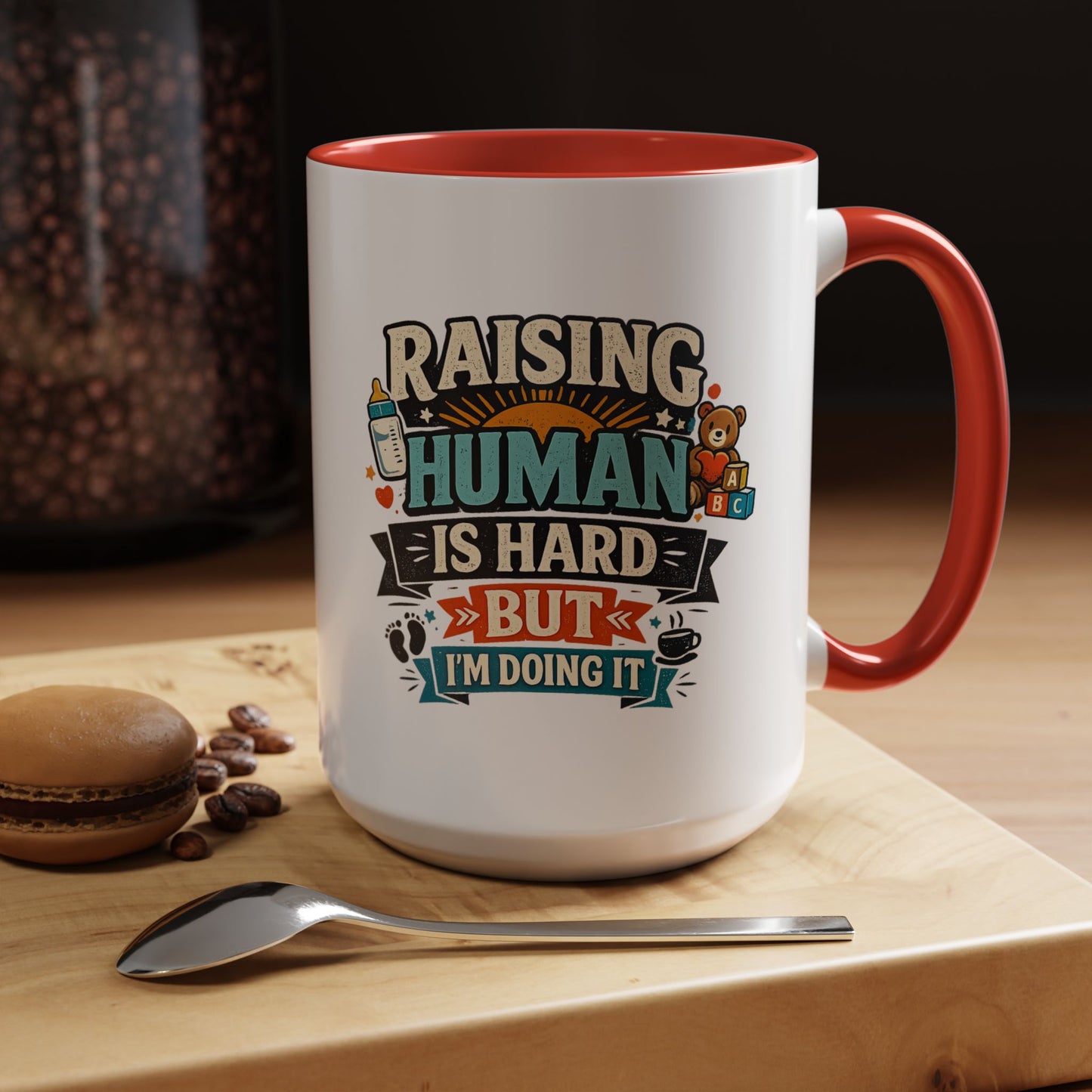 Accent Coffee Mug — "Raising Humans Is Hard But I'm Doing It"