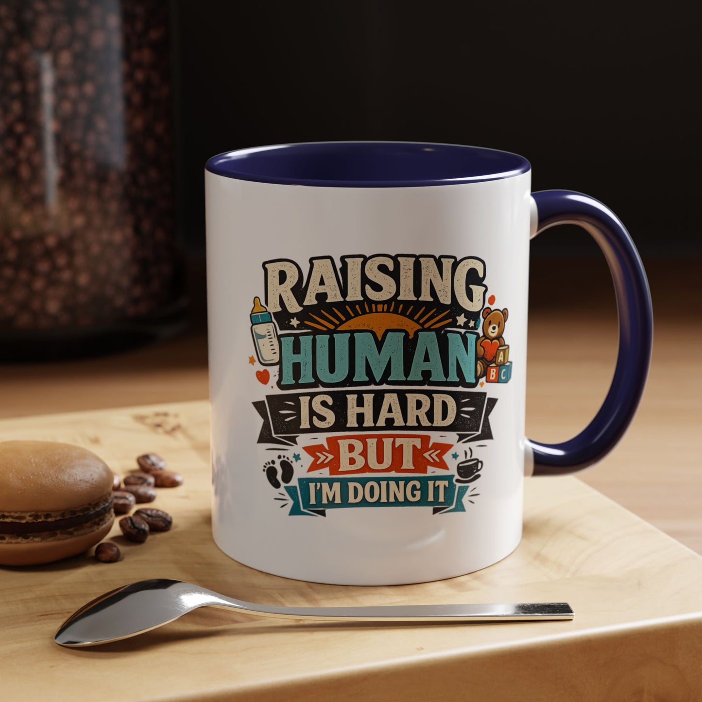 Accent Coffee Mug — "Raising Humans Is Hard But I'm Doing It"