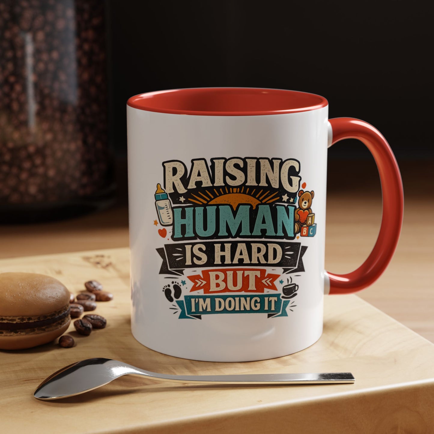 Accent Coffee Mug — "Raising Humans Is Hard But I'm Doing It"