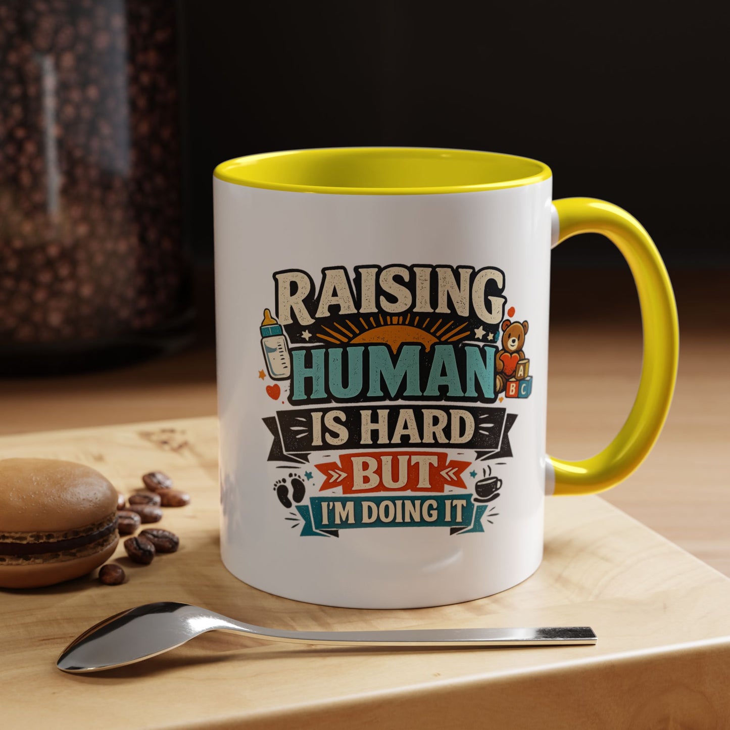 Accent Coffee Mug — "Raising Humans Is Hard But I'm Doing It"